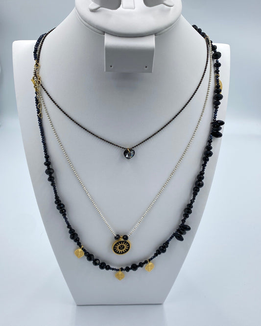 Set of Necklaces in black stones with gold leaves.